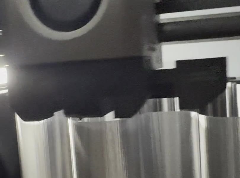 The print head laying down layers on a silver wavy shade