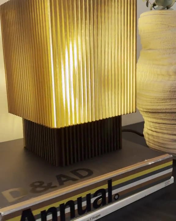LINJE in Amber, glowing on a stack of books