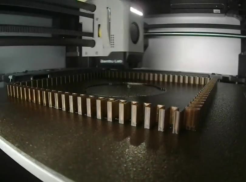 LINJE being printed: a square frame of ribs rising layer by layer